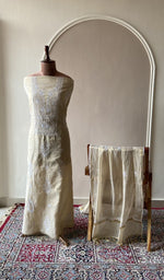 Beige tissue chanderi set on the mannequin with its dupatta