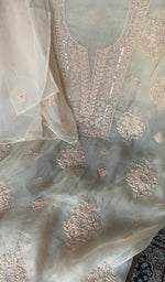 Motifs across the body of the beige kurta
