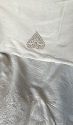 Close view of the cream kurta fabric
