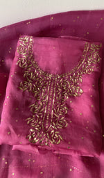 Pink pure organza silk kurta piece folded, badla work on gala and boota