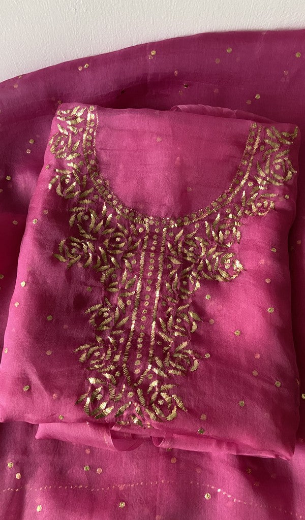 Pink pure organza silk kurta piece folded, badla work on gala and boota