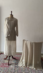The set on the mannequin with its dupatta beside it