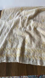 The kurta piece folded on the carpet