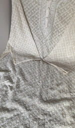 Motifs across the body of the white kurta