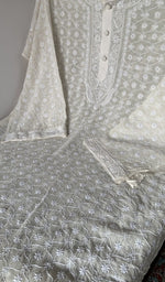 Motifs across the body of the white kurta