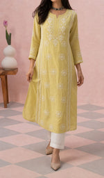 Yellow kurti from the front, styled with a white pant