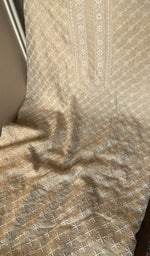Beige munga silk laid out flat