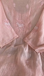 The peach pink kurta, spread out flat