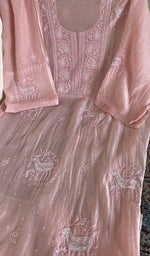 Peach pink mul chanderi laid flat on the table