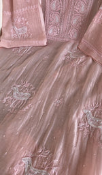 Close view of the peach pink kurta fabric