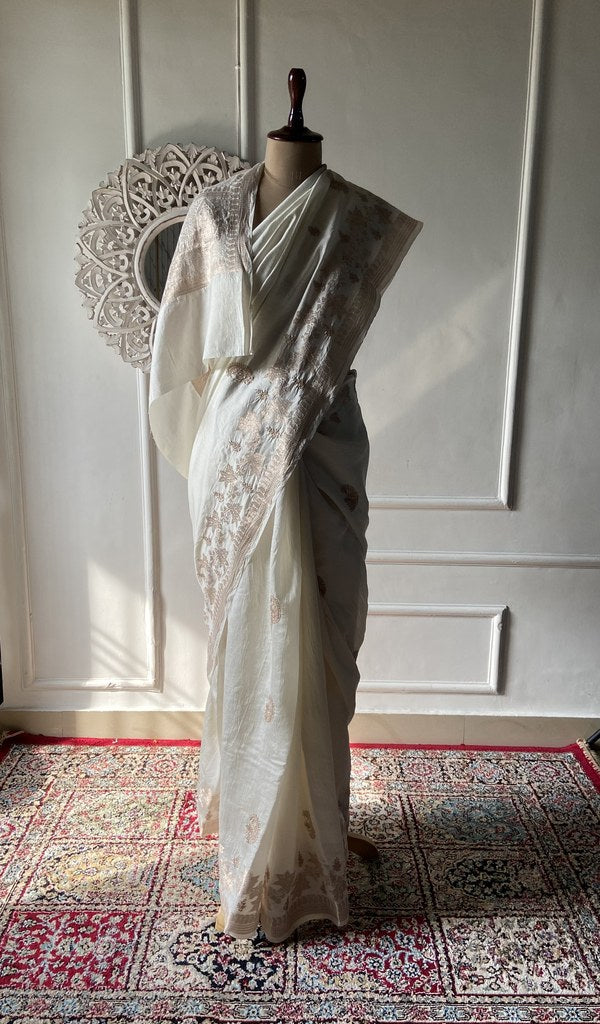 off white pure silk chikankari saree draped on the mannequin