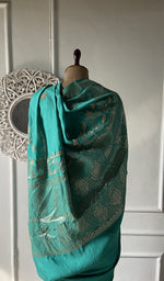 Load image into Gallery viewer, the saree in full, folded on the stool