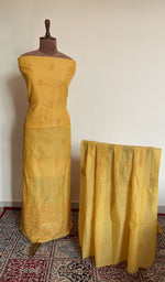 Mustard chanderi silk set on the mannequin with its dupatta