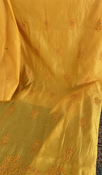 Mustard chanderi silk laid flat on the table