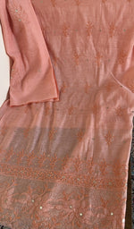 Peach chanderi silk laid flat on the table
