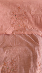Stitch detail on the peach chanderi silk kurta