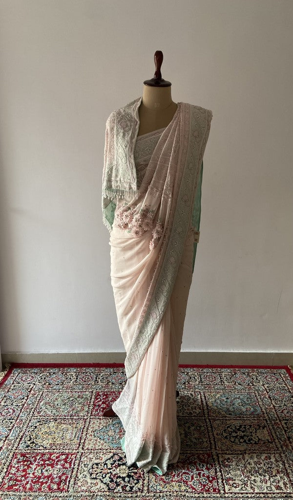 Pink pure silk georgette saree draped on the mannequin