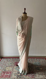 Pink pure silk georgette saree draped on the mannequin