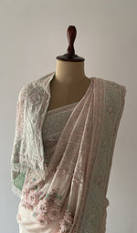 Pallu falling over the shoulder, extremely fine ek and do taar chikankari