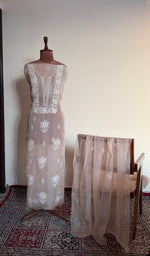 Peach organza silk set on the mannequin with its dupatta