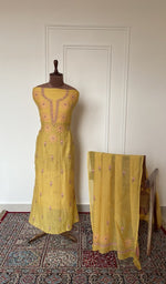 Mustard mul chanderi set on the mannequin with its dupatta