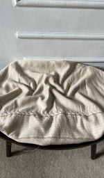 Bottom fabric draped over the stool