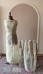 Ivory organza silk set on the mannequin with its dupatta