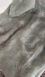 The sage grey kurta, spread out flat