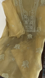 Butter yellow organza silk laid out flat