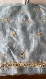 The powder blue kurta, spread out flat