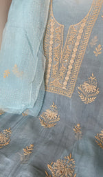 Powder blue organza silk laid out flat