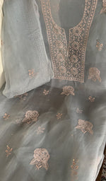 Powder blue organza silk laid out flat