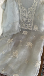 Powder blue organza silk laid out flat