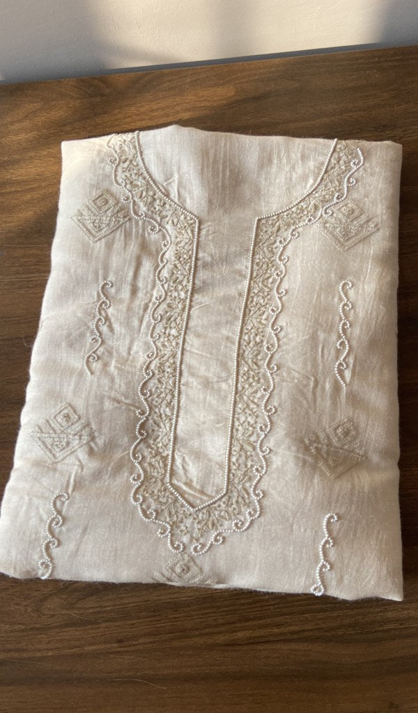 Folded white eri silk kurta, front view