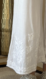 Hem embroidery on the white palazzo, up close