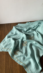 The kurta piece folded on the carpet