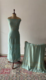 The set on the mannequin with its dupatta beside it