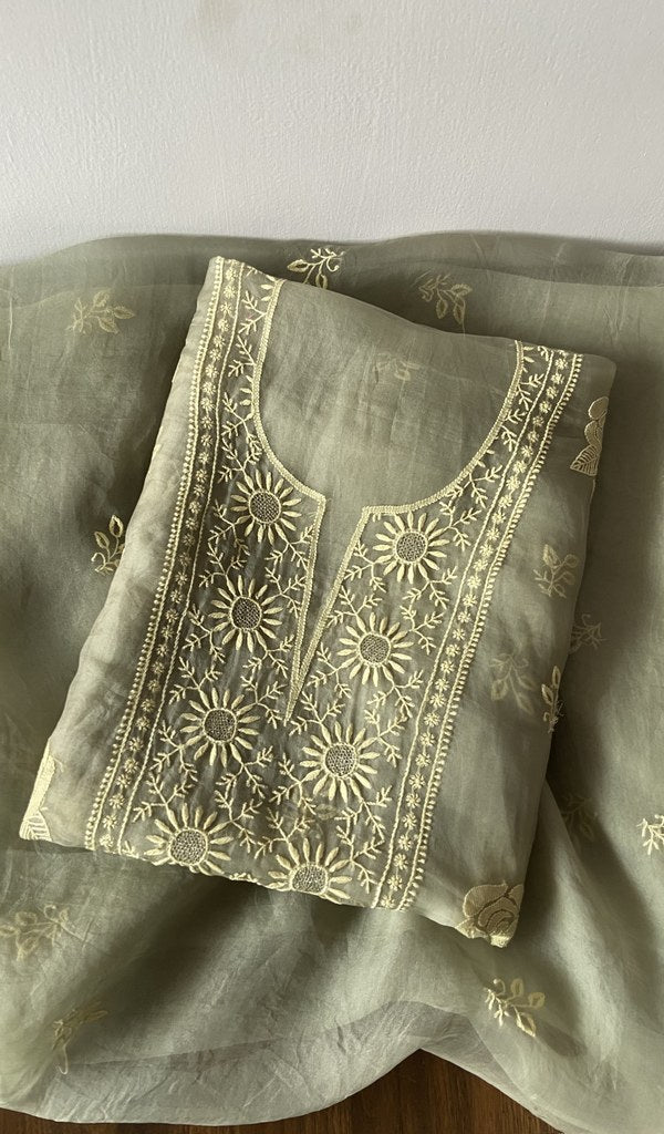 Green pure organza silk kurta piece folded, do taar and teen taar chikankari with zari haath ki jaali
