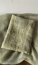 Green pure organza silk kurta piece folded, do taar and teen taar chikankari with zari haath ki jaali