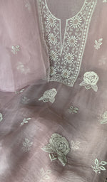 Motifs across the body of the purple kurta