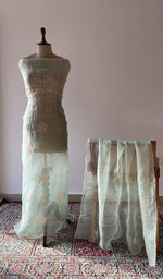 The set on the mannequin with its dupatta beside it