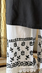 Hem embroidery on the white palazzo, up close