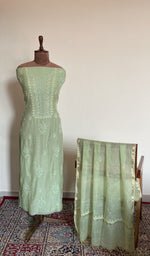 Pista green mul chanderi set on the mannequin with its dupatta