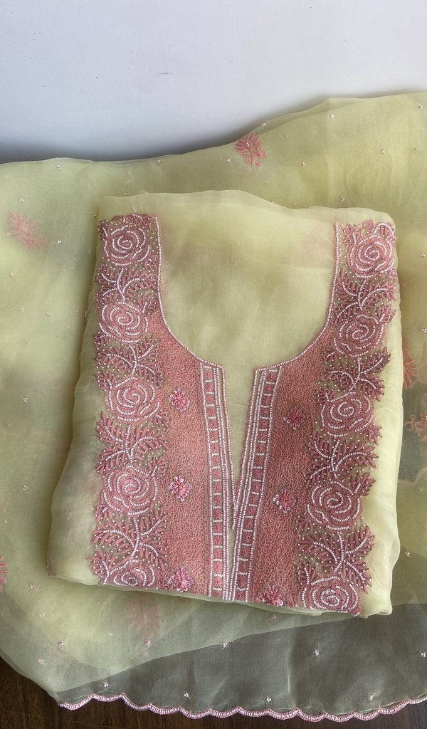 Lemon yellow organza silk kurta piece folded, gala work in front