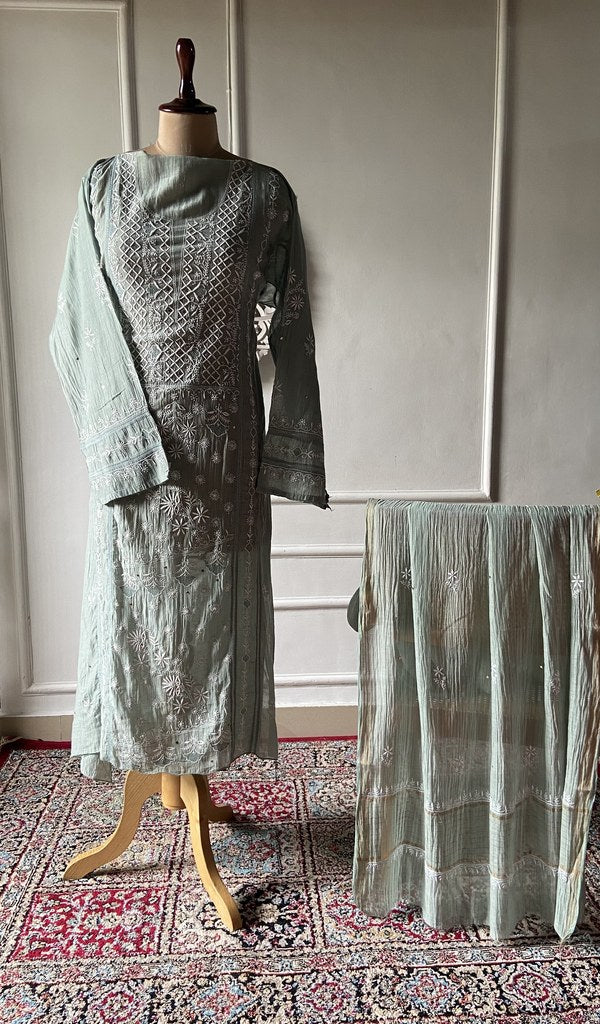green pure mul chanderi chikankari set on the mannequin, dupatta on the stand