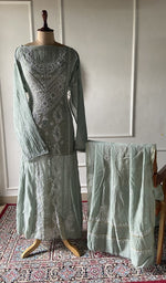 将图像加载到图库查看器中， Sage green pure mul chanderi chikankari 3 pc semi-stitched suit set laid out