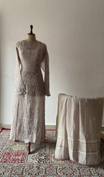 The set on the mannequin with its dupatta beside it