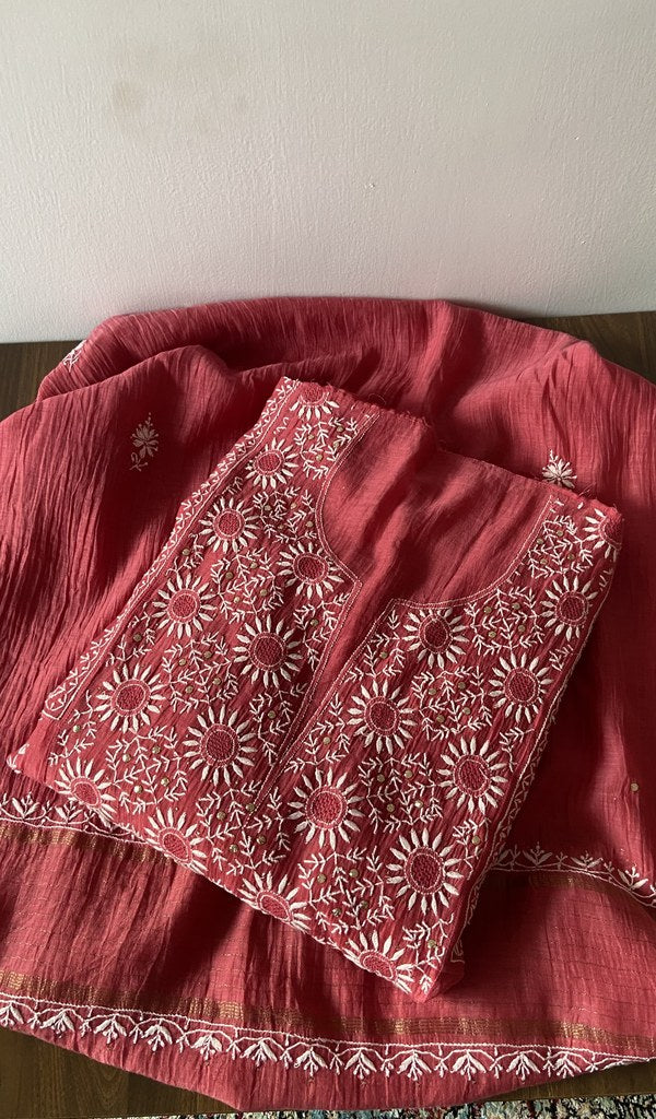 Folded red pure mul chanderi kurta piece with chikankari on the panel