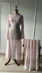 The set on the mannequin with its dupatta beside it