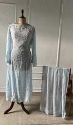 The set on the mannequin with its dupatta beside it